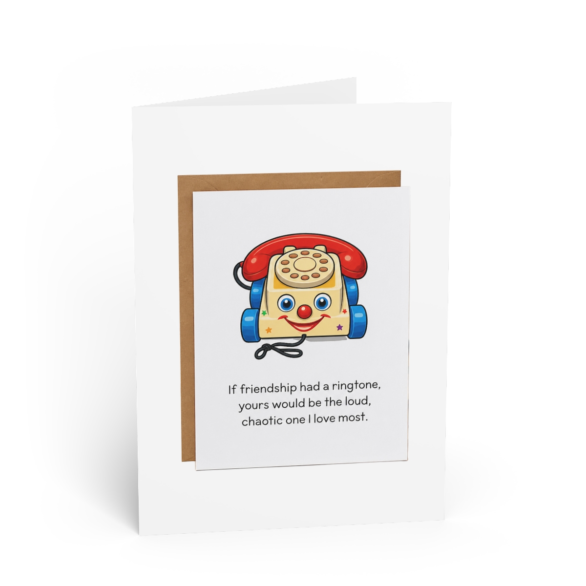 Greeting card with a cartoon image of a red and yellow toy telephone with blue wheels and a smiling face. The card reads: "If friendship had a ringtone, yours would be the loud, chaotic one I love...